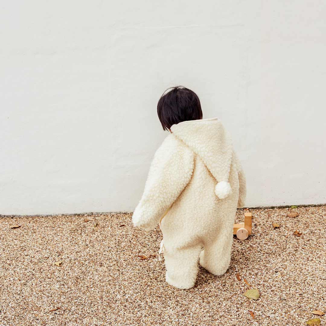 BINIBAMBA Merino Sheepskin Snugglesuit - Milk - Image 5